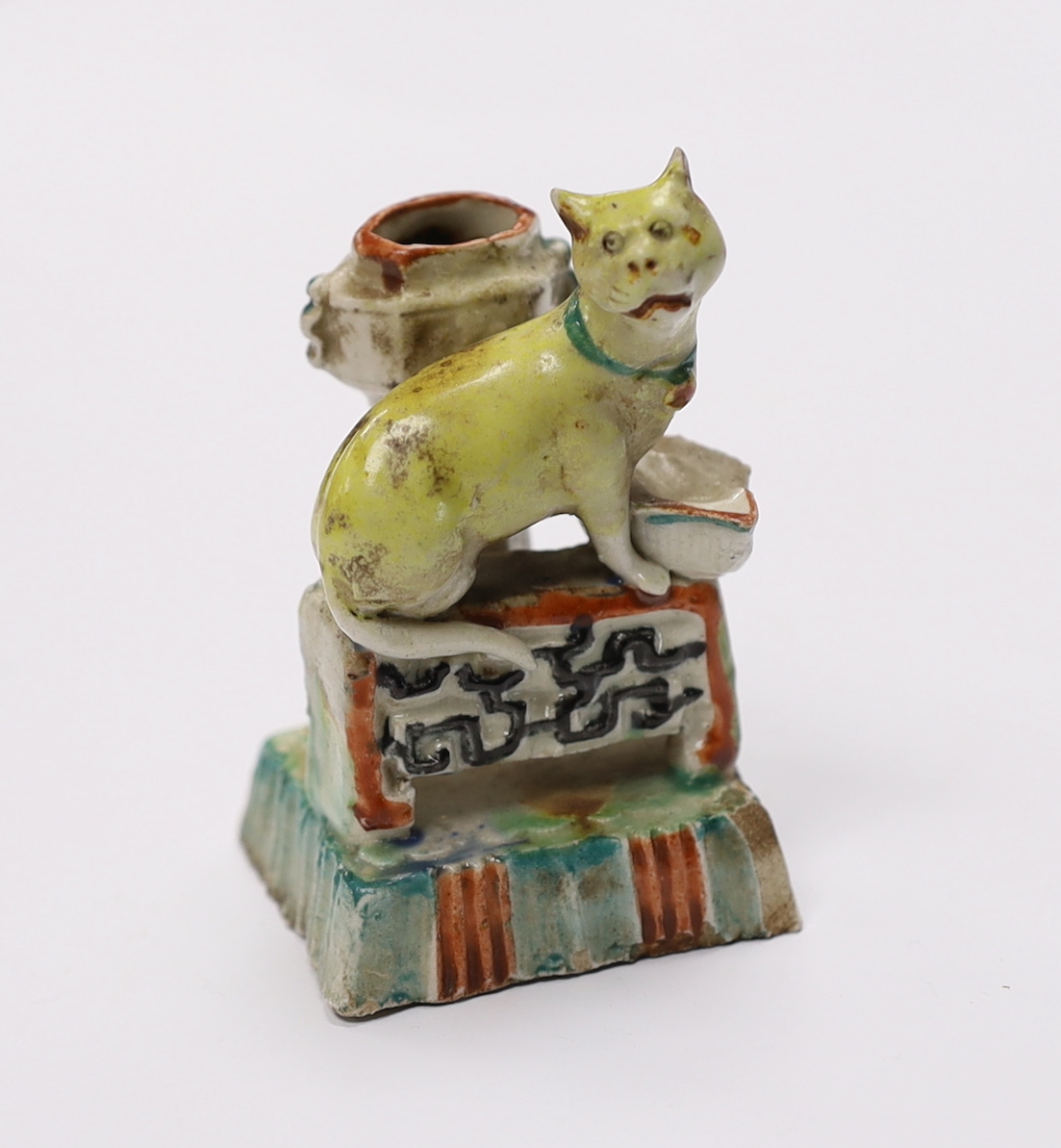 An 18th century Chinese enamelled blanc de chine 'cat' joss stick holder, 7cm